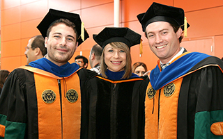 Students with Professor at Graduation